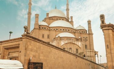 A bustling scene at the historic Mosque of Muhammad Ali in Cairo, Egypt.